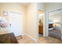 Bright entryway with a view of the bathroom and another bedroom at 3045 Beach Palm Ave, Kissimmee, FL 34747