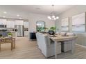 Open dining area with a light wood table and neutral decor at 3215 Arch Ave, Ormond Beach, FL 32174