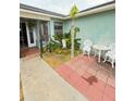 Inviting front patio with seating area and lush landscaping at 3250 Dellbrook Dr, Deltona, FL 32738