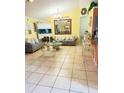 Bright living room featuring tile floors and neutral decor at 3250 Dellbrook Dr, Deltona, FL 32738