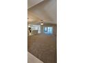 Spacious living room with carpeting, high ceilings and access to kitchen at 32712 Timberwood Dr, Leesburg, FL 34748