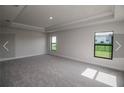 Spacious bedroom with neutral carpeting and large windows at 4284 Sagefield Drive, St Cloud, FL 34773