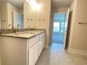 Double vanity bathroom with granite countertops and upgraded faucets at 4312 Sagefield Drive, St Cloud, FL 34773