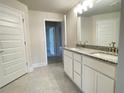 Double vanity bathroom with granite countertops and upgraded faucets at 4312 Sagefield Drive, St Cloud, FL 34773