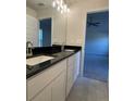 Double vanity bathroom with granite countertops and updated fixtures at 4486 Segafield, St Cloud, FL 34773
