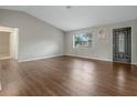 Bright living room featuring hardwood floors and neutral walls at 5405 Justine Way, Winter Park, FL 32792