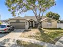 Single-Gathering home with a two-car garage and mature landscaping at 933 El Lago Ter, Winter Springs, FL 32708