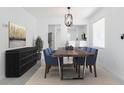 Elegant dining room with a live edge table and six chairs at 12162 Graduate Dr, Orlando, FL 32826