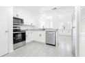 Modern kitchen featuring stainless steel appliances and granite countertops at 12162 Graduate Dr, Orlando, FL 32826