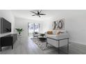 Bright and airy living room with sliding glass doors to patio at 12162 Graduate Dr, Orlando, FL 32826