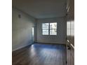 Living room with large windows and access to a private patio at 1230 Southstation Pl # 105, Orlando, FL 32809