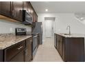 Modern kitchen with granite countertops and stainless steel appliances at 1496 Broad Wing Ln, Winter Park, FL 32792