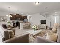 Open-concept living area with kitchen, dining, and seating at 1496 Broad Wing Ln, Winter Park, FL 32792