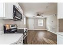 Bright living room with hardwood floors and ceiling fan at 1913 Nw 12Th St, Ocala, FL 34475
