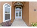 Front entry with double doors and sidelights, featuring a walkway at 1943 Sipes Ave, Sanford, FL 32771