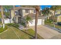 Two-story house with a white garage door and stone accents at 3251 Brewster Dr, Kissimmee, FL 34743