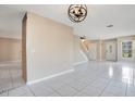 Bright living room with tile floors and a staircase at 3251 Brewster Dr, Kissimmee, FL 34743