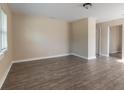 Spacious living room with wood-look floors and neutral walls at 421 Jefferson St, Daytona Beach, FL 32114
