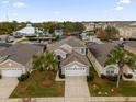 Aerial view showing house, community amenities, and landscape at 8106 Fan Palm Way, Kissimmee, FL 34747
