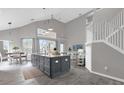 Open-concept kitchen with an island and high ceilings at 8106 Fan Palm Way, Kissimmee, FL 34747