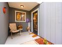 Inviting front porch with seating and fall decorations at 844 Sugar House Dr, Port Orange, FL 32129