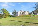Landscaped yard and house from a side view at 935 Don Wilson Ave, Apopka, FL 32712