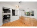 Modern kitchen featuring dark cabinetry and granite countertops at 1937 Eland Ave, Winter Park, FL 32789