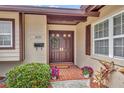 Inviting front entrance with double doors and landscaping at 2231 Deloraine Trl, Maitland, FL 32751