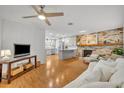 Bright living room with hardwood floors and fireplace at 2231 Deloraine Trl, Maitland, FL 32751