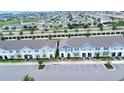 Aerial view of community showing townhomes and surrounding landscape at 2432 Dubai St, Kissimmee, FL 34747