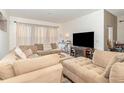 Relaxing living room with sectional sofa and a fireplace at 250 Merry Brook Cir, Sanford, FL 32771