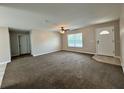 Bright living room with large windows and ceiling fan at 2650 Sw 162Nd Ln, Ocala, FL 34473