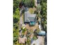 Aerial view showing home, pool, detached garage, and expansive lot at 3290 Red Fox Dr, Deltona, FL 32725