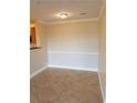 Separate dining area with tile floors and wainscoting at 3700 Castle Pines Ln # 4032, Orlando, FL 32839