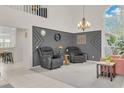 Relaxing living room with two armchairs, a coffee table, and a large window at 4549 Saddleworth Cir, Orlando, FL 32826