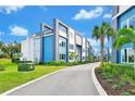 Private residential community with townhomes and palm trees at 7740 Sandy Ridge Dr # 111, Reunion, FL 34747