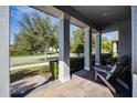 Relaxing front porch with two adirondack chairs and view of the neighborhood at 8547 Bayview Crossing Dr, Winter Garden, FL 34787