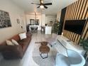 Open concept living room with adjacent kitchen and dining area at 8824 Dunes Ct # 103, Kissimmee, FL 34747