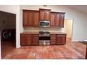 Bright kitchen with ample cabinetry and granite countertops at 10810 Dearden Cir, Orlando, FL 32817