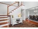 Entryway with staircase, brick flooring, and a white console table at 1718 Errol Woods Dr, Apopka, FL 32712