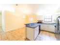 Kitchen with stainless steel appliances and light-colored cabinets at 3934 Ne 21St Ln, Ocala, FL 34470