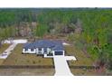 Luxury home on spacious lot with large driveway and wooded surroundings at 39715 Royal Trails Road, Eustis, FL 32736