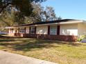 Ranch house with red shutters and brick foundation at 4131 Yorketowne Rd, Orlando, FL 32812