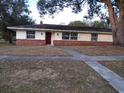 Ranch style home with brick facade and large windows at 4131 Yorketowne Rd, Orlando, FL 32812