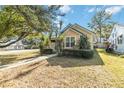 Tan house with green metal roof and walkway at 436 E Jersey St, Orlando, FL 32806