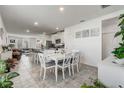 Open concept kitchen with white cabinets and granite countertops at 4451 Rapallo Ave, Winter Haven, FL 33884