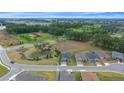 Aerial view of a community with houses, trees, and golf course at 5390 Nw 43Rd St, Ocala, FL 34482