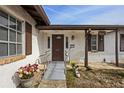 Welcoming front entrance with ramp access and attractive landscaping at 6517 Precourt Dr, Orlando, FL 32809