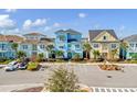 Row of colorful houses with tile roofs and palm trees at 8153 Surf St, Kissimmee, FL 34747