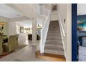 Elegant staircase leading to the second floor with a view of the living areas at 8511 La Isla Dr, Kissimmee, FL 34747